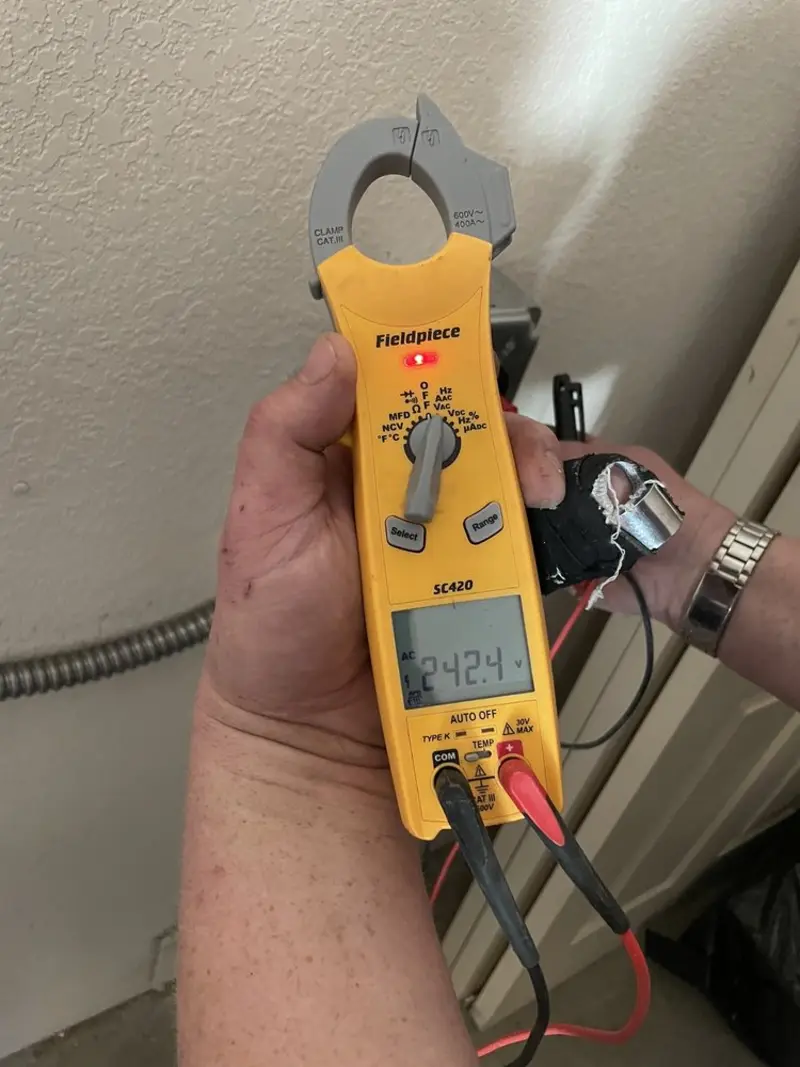Voltage testing with clamp meter during Whole House Surge Protector in Pawling